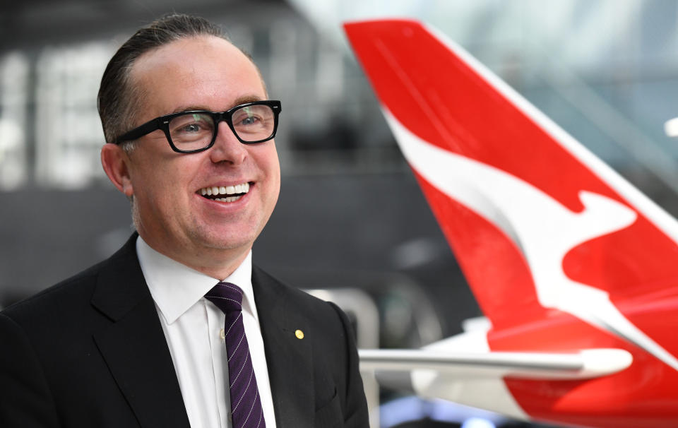 SYDNEY, AUSTRALIA - AUGUST 23: Alan Joyce smiles next to a model of a Qantas Boeing 787 Dreamliner aircraft after the Qantas full year results press conference on August 23, 2018 in Sydney, Australia. Qantas announced full year underlying profit before tax at a record of $1.6billion Australian dollars up 14% on the year before. The company also announced that 27,000 non-executive employees will share a bonus pool of $67 million Australian dollars - an average of just under $2,500 per employee.  (Photo by James D. Morgan/Getty Images)