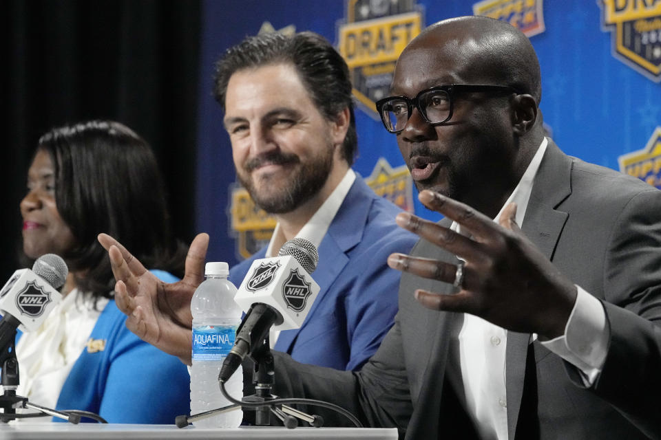 Former NHL hockey player Anson Carter, right, delivers remarks during news conference, Wednesday, June 28, 2023, in Nashville, Tenn. Tennessee State University announced plans to become the first historically Black college and university to introduce ice hockey. The program has been created in partnership with the National Hockey League, National Hockey League Players' Association and the Nashville Predators. (AP Photo/George Walker IV)