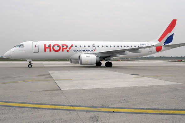 An Air France regional airline subsidiary Hop! Embraer 190 plane stands on the tarmac during the presentation of the aircraft of the new company at Paris-Orly airport on March 26, 2013. AFP PHOTO/  ERIC PIERMONT        (Photo credit should read ERIC PIERMONT/AFP/Getty Images)