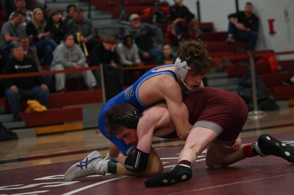 State College’s Noah Young looks to finish off a shot attempt on Central Mountain’s Gavin Heverly in their 107 pound PIAA Class 3A Northwest Regional final on Saturday, Feb. 24, 2024 in Altoona. Heverly pinned Young in 4:40.