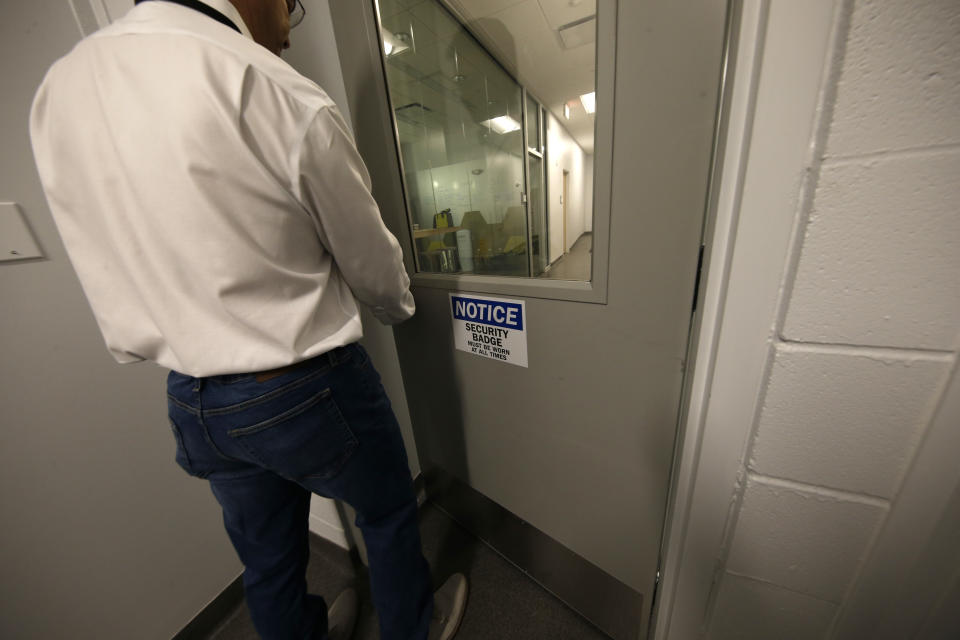 John Davis, president of GB Sciences Louisiana, walks through a secure area of the facility, which grows and processes medical marijuana, in Baton Rouge, La., Tuesday, Aug. 6, 2019. (AP Photo/Gerald Herbert)