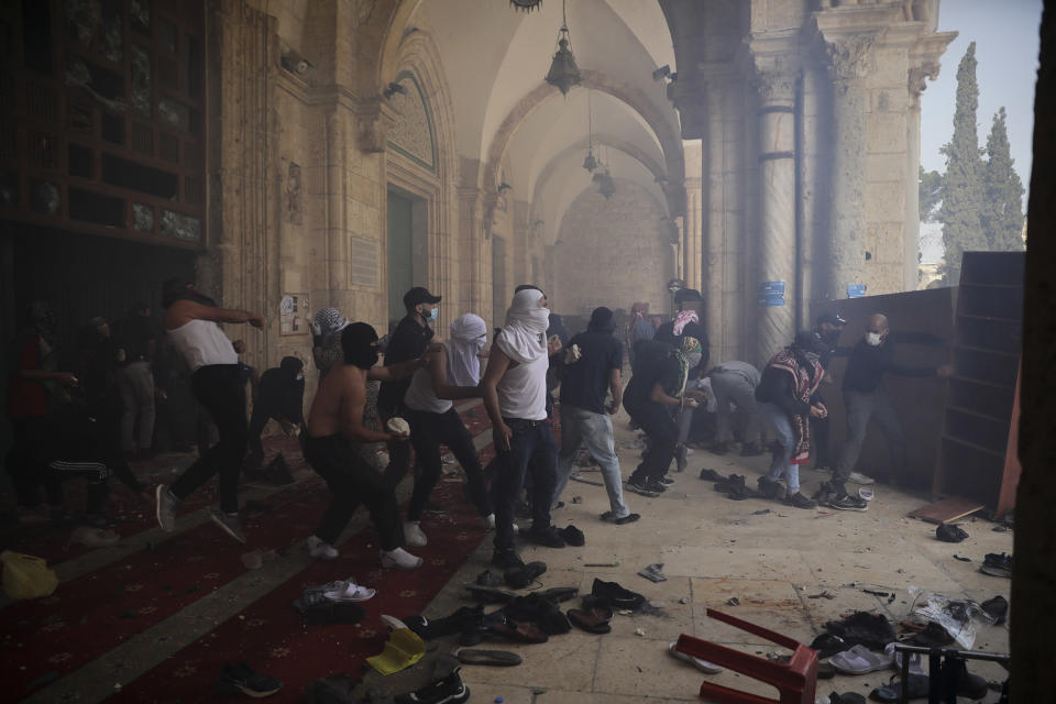 Image: Palestinians clash with Israeli security forces at the Al Aqsa Mosque compound in Jerusalem's Old City on Monday. (Mahmoud Illean / AP)