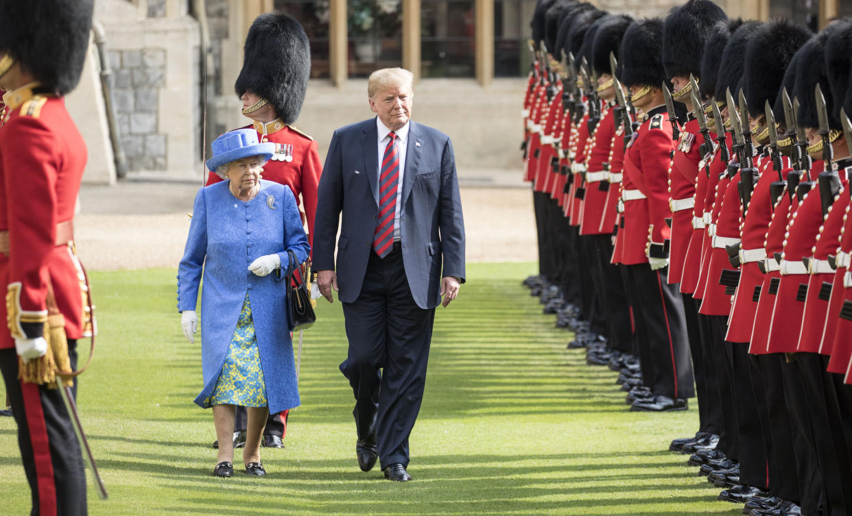 The Queen walks with President Trump as they inspect the Coldstream guards at Windsor castle.
