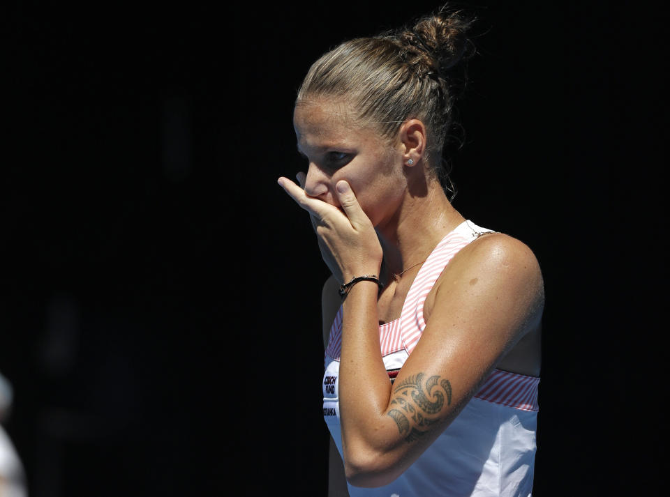 Karolina Pliskova of the Czech Republic reacts after defeating United States' Serena Williams in their quarterfinal match at the Australian Open tennis championships in Melbourne, Australia, Wednesday, Jan. 23, 2019. (AP Photo/Kin Cheung)