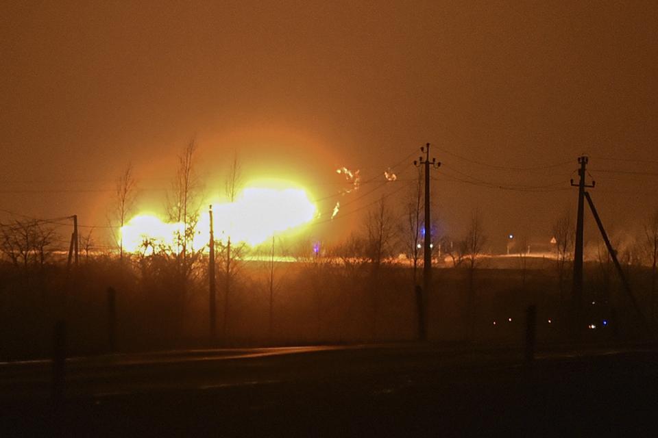 A flame rises after an explosion at a gas pipeline near Pasvalys, 175 km (109 miles) north of Vilnius in northern Lithuania on Friday, Jan. 13, 2023. Officials say an explosion has occurred in a pipeline in central Lithuania carrying natural gas to the north of the country and neighboring Latvia but no supply disruptions or injuries were reported. Baltic media reported that Friday's blast sent flames up to 50 meters (164 feet) into the sky and forced the protective evacuation of a nearby village. (AP Photo/Paulius Zidonis)