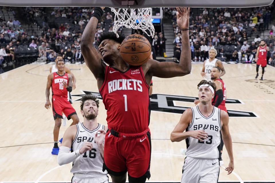 Houston Rockets forward Jabari Smith Jr. (1) scores against the San Antonio Spurs during the second half of a preseason NBA basketball game in San Antonio, Monday, Oct. 16, 2023. (AP Photo/Eric Gay)