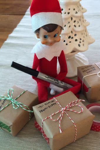 28) Elf on the Shelf Wrapping Gifts Idea