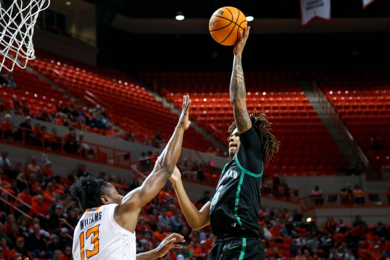 North Texas guard Rubin Jones (15) jumps to shoot in the second half during a college basketball game in the quarterfinals of the National Invitational Tournament between the Oklahoma State Cowboys (OSU) and the North Texas Mean Green at Gallagher-Iba Arena in Stillwater, Okla., Tuesday, March 21, 2023.
