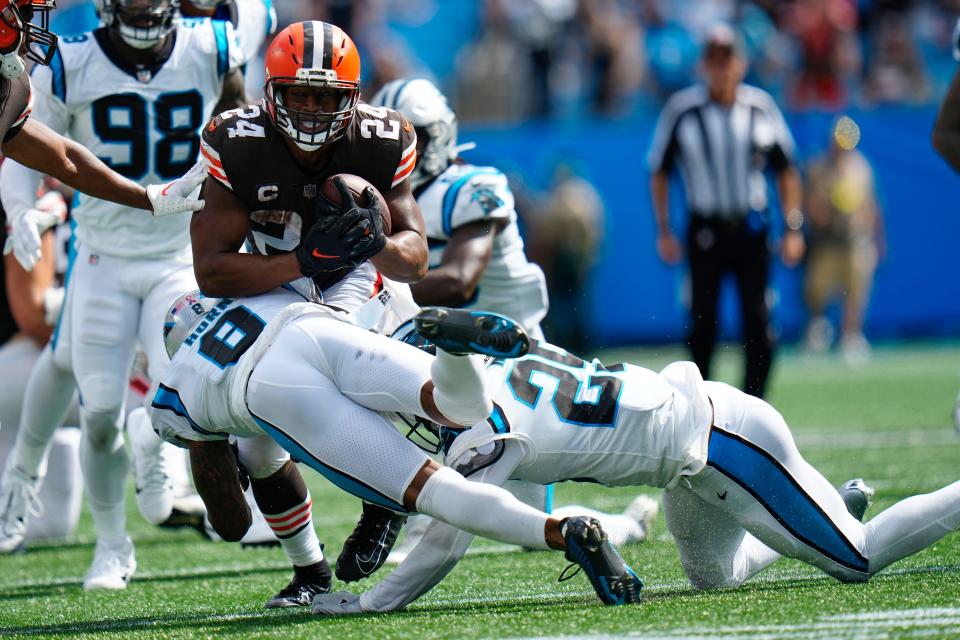 Browns running back Nick Chubb is tackled by Panthers cornerback Jaycee Horn during the second half Sunday, Sept. 11, 2022, in Charlotte, N.C.