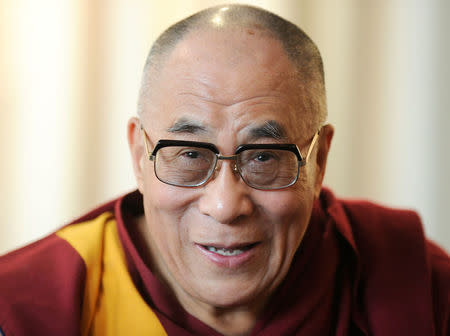 FILE PHOTO: Tibetan spiritual leader the Dalai Lama smiles during a news conference in Hamburg, August 21, 2011. REUTERS/Fabian Bimmer/File Photo