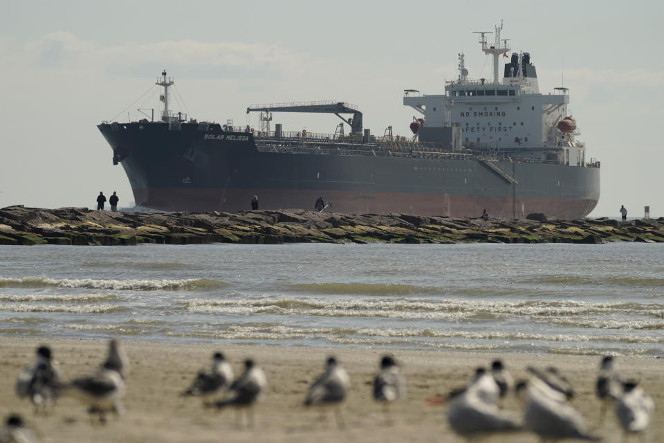 FILE - An oil tanker passes along a channel, March 2, 2022, in Port Aransas, Texas. President Joe Biden's administration has approved construction of The Sea Port Oil Terminal, a deepwater oil export terminal off the Texas coast that would be the largest of its kind in the United States. Environmentalists called the move a betrayal of Biden’s climate agenda and said would lead to planet-warming greenhouse gas emissions equivalent to nearly 90 coal fired-power plants. (AP Photo/Eric Gay, File)