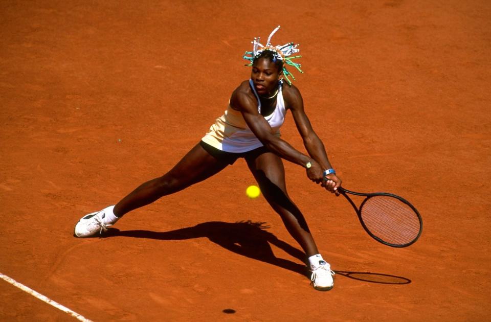 Serena Williams stretches for a backhand during the 1998 French Open when she was 16 years old. <a href="https://www.gettyimages.com/detail/news-photo/serena-williams-of-the-usa-stretches-for-a-backhand-during-news-photo/1292873?adppopup=true" rel="nofollow noopener" target="_blank" data-ylk="slk:Clive Brunskill /Allsport via Getty Images;elm:context_link;itc:0;sec:content-canvas" class="link ">Clive Brunskill /Allsport via Getty Images</a>