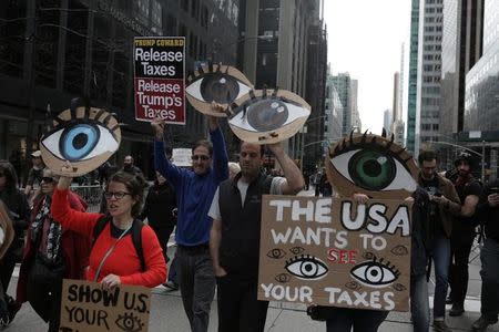 People march demanding U.S. President Donald Trump release his tax returns, in New York, U.S., April 15, 2017. REUTERS/Joe Penney