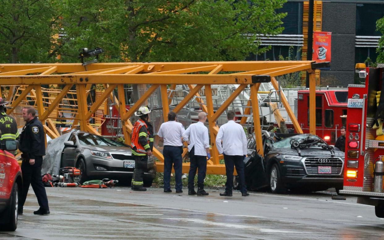 Emergency crews work at the scene of a construction crane collapse in Seattle - The Seattle Times