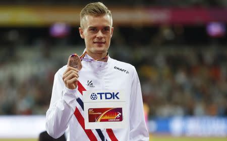 FILE PHOTO: Athletics - World Athletics Championships – men’s 1500 metres victory ceremony – London Stadium, London, Britain – August 13, 2017 – Filip Ingebrigtsen of Norway (Bronze) poses with the medal. REUTERS/Matthew Childs