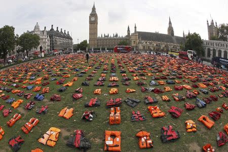 A display of lifejackets worn by refugees during their crossing from Turkey to the Greek island of Chois, are seen Parliament Square in central London, Britain September 19, 2016. REUTERS/Stefan Wermuth