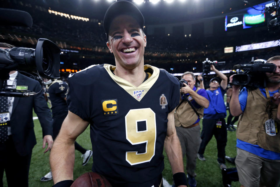 FILE - In this Dec. 16, 2019, file photo, New Orleans Saints quarterback Drew Brees (9) smiles after defeating the Indianapolis Colts 34-7 in an NFL football game in New Orleans. A person familiar with the situation says the Saints and record-setting quarterback Drew Brees have agreed on a two-year, $50 million contract. The person spoke to The Associated Press on condition of anonymity on Tuesday, March 17, 2020, because the deal has not been announced. (AP Photo/Butch Dill, Fle)