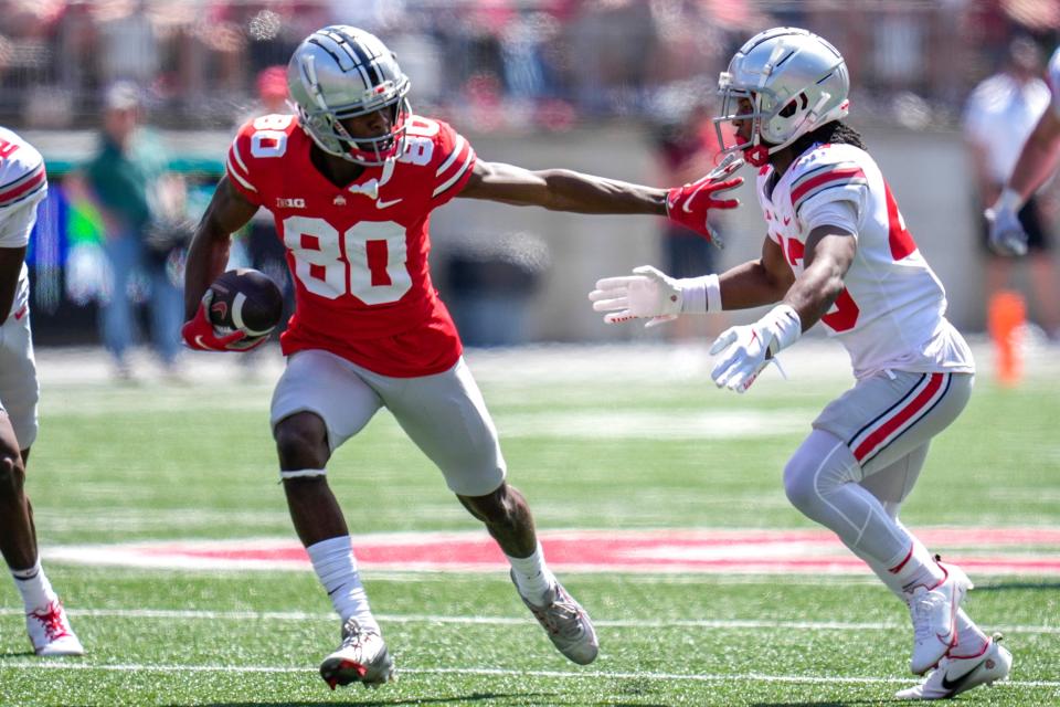 Apr 15, 2023; Columbus, Ohio, United States;  Ohio State Buckeyes wide receiver Noah Rogers (80) evades Ohio State Buckeyes cornerback Diante Griffin (43) during the fourth quarter of the Ohio State Buckeyes spring game at Ohio Stadium on Saturday morning. Mandatory Credit: Joseph Scheller-The Columbus Dispatch