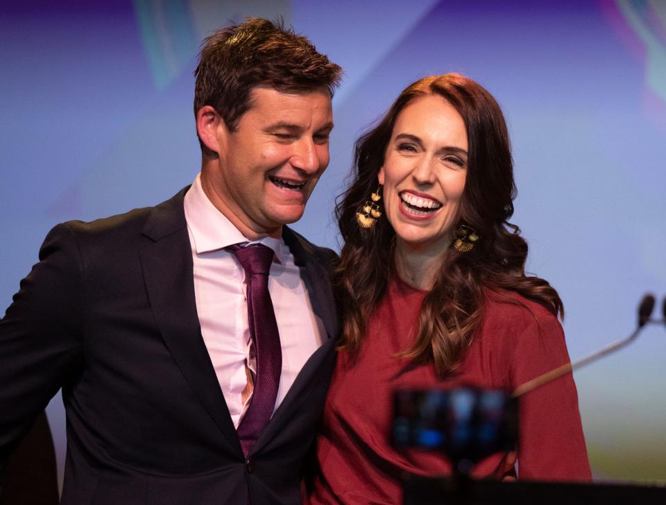 New Zealand Prime Minister Jacinda Ardern, right, is congratulated by her partner Clarke Gayford following her victory speech to Labour Party members at an event in Auckland, New Zealand, Saturday, Oct. 17, 2020