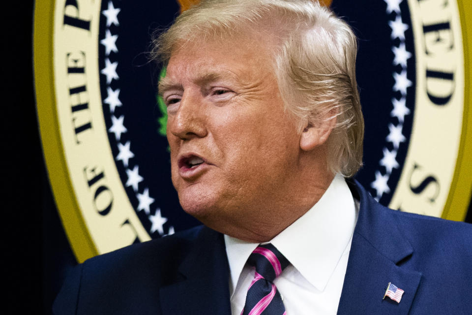 President Donald Trump responds to the invited guests during a summit on transforming mental health treatment to combat homelessness, violence, and substance abuse, at the he Eisenhower Executive Office Building on the White House complex in Washington, Thursday, Dec. 19, 2019, in Washington. (AP Photo/Manuel Balce Ceneta)