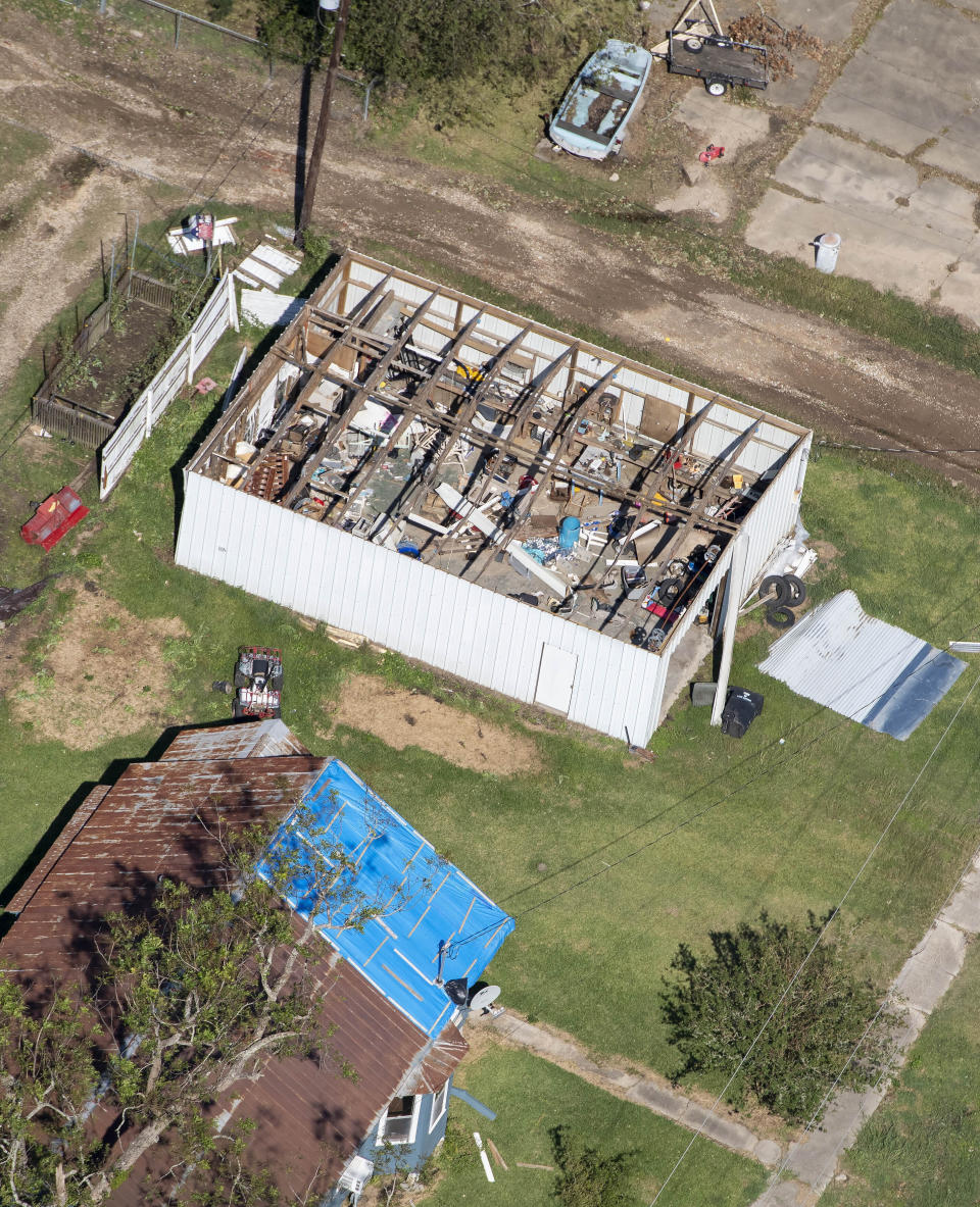 Blue tarps and destruction are seen in the aftermath of Hurricane Delta Saturday Oct. 10, 2020, in Lake Arthur, La. (Bill Feig/The Advocate via AP, Pool)