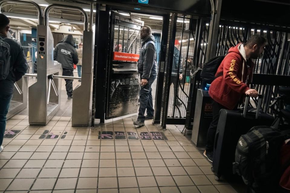 Fare evasion is so routine that people walked through an emergency exit, avoiding paying $2.90, despite the heavy police presence in the Times Square station. Stefano Giovannini