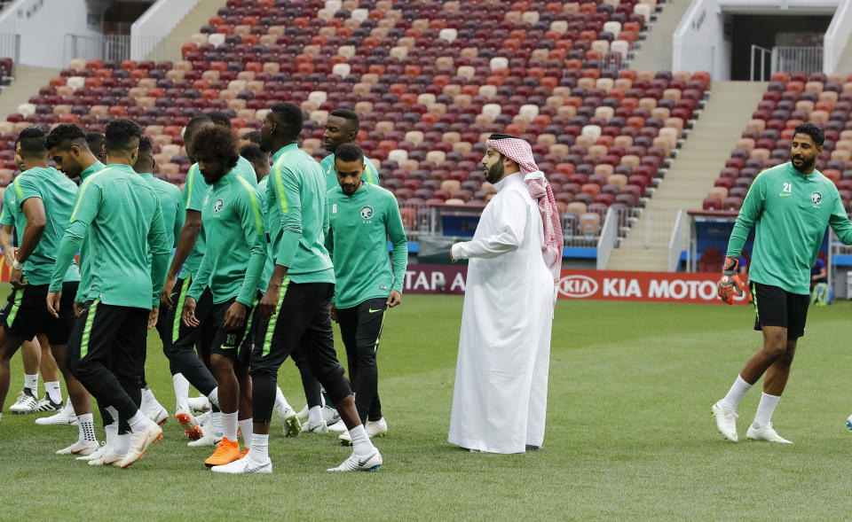 FILE - In this June 13, 2018 file photo, Saudi Arabia's sports minister Turki Alsheikh talks to the national soccer team players at the 2018 soccer World Cup at Luzhniki stadium in Moscow, Russia. Egypt’s close relations with Saudi Arabia are being tested by a soccer spat sparked by an uproar over meddling by Alsheikh. The minister’s attempts over the last year to exert control of Egypt’s biggest team enraged fans, officials and one of the country’s greatest players. The acrimonious fallout led to the confidant of Saudi Arabia’s powerful crown prince buying a rival club in a bid to challenge Al-Ahly’s supremacy. (AP Photo/Antonio Calanni, File)