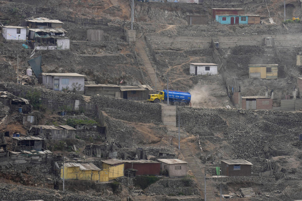 A water truck passes through Pamplona Alta area in Lima, Peru, Thursday, March 7, 2024. Peru’s government gives potable water to 1.5 million of its poorest residents living in the hills. (AP Photo/Martin Mejia)