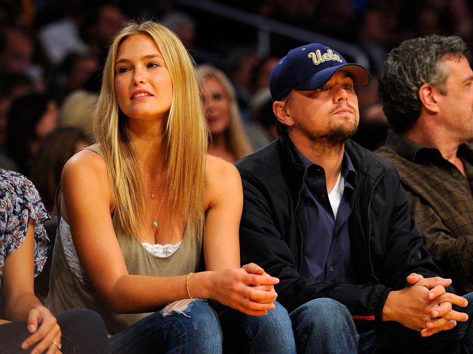 Bar Refaeli and Leonardo DiCaprio sit courtside at a Los Angeles Lakers game in 2010.