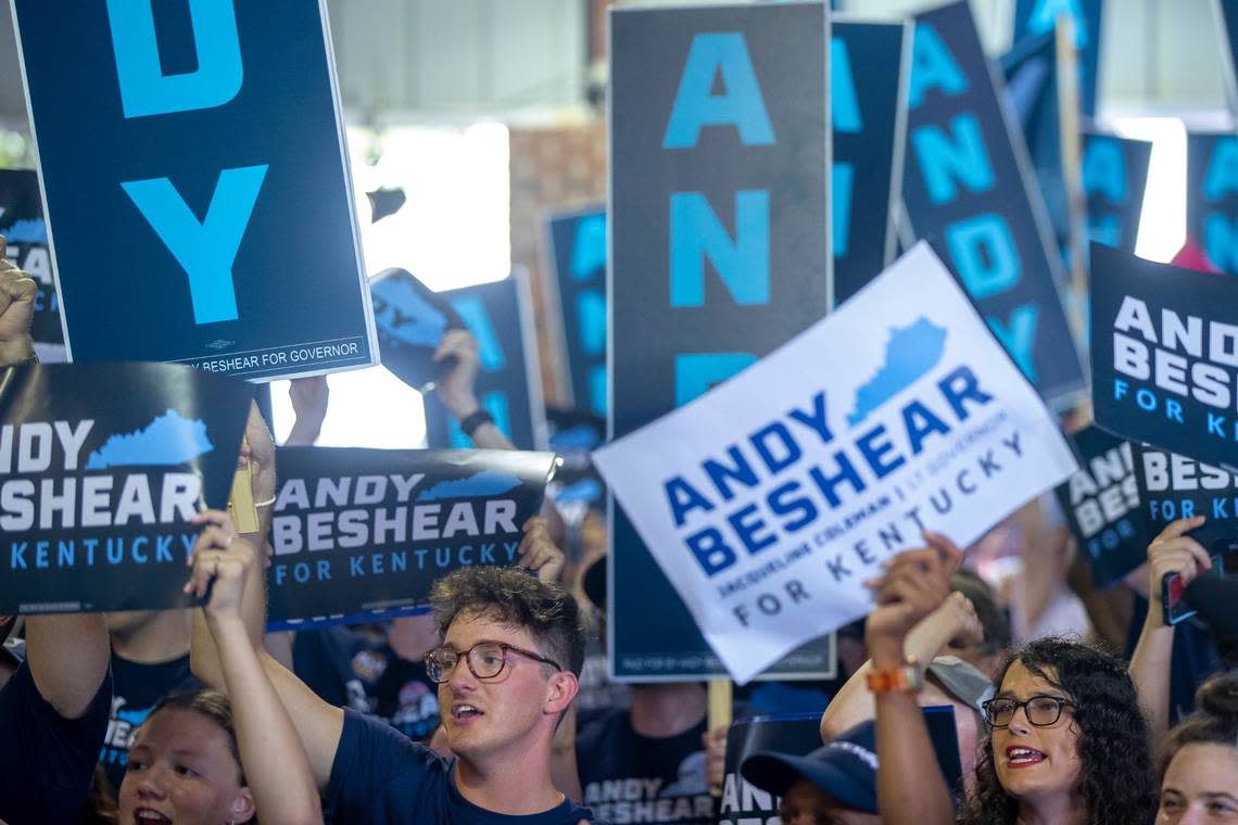 Kentucky Gov. Andy Beshear supporters hold signs and cheer during the annual St. Jerome Fancy Farm Picnic in Fancy Farm, Ky., on Saturday, Aug. 5, 2023. Ryan C. Hermens/rhermens@herald-leader.com