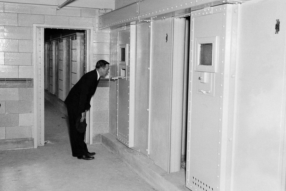 FILE - In this May 23, 1935 file photo, solitary confinement cells are shown at Rikers Island prison in New York. New York City officials have unveiled reforms they claim add up to a groundbreaking ban on solitary confinement on Rikers Island. (AP Photo/John Rooney, File)