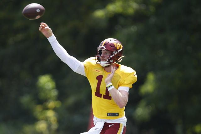 Washington Commanders quarterback Carson Wentz (11) in action during the  first half of a preseason NFL football game against the Carolina Panthers,  Saturday, Aug. 13, 2022, in Landover, Md. (AP Photo/Nick Wass