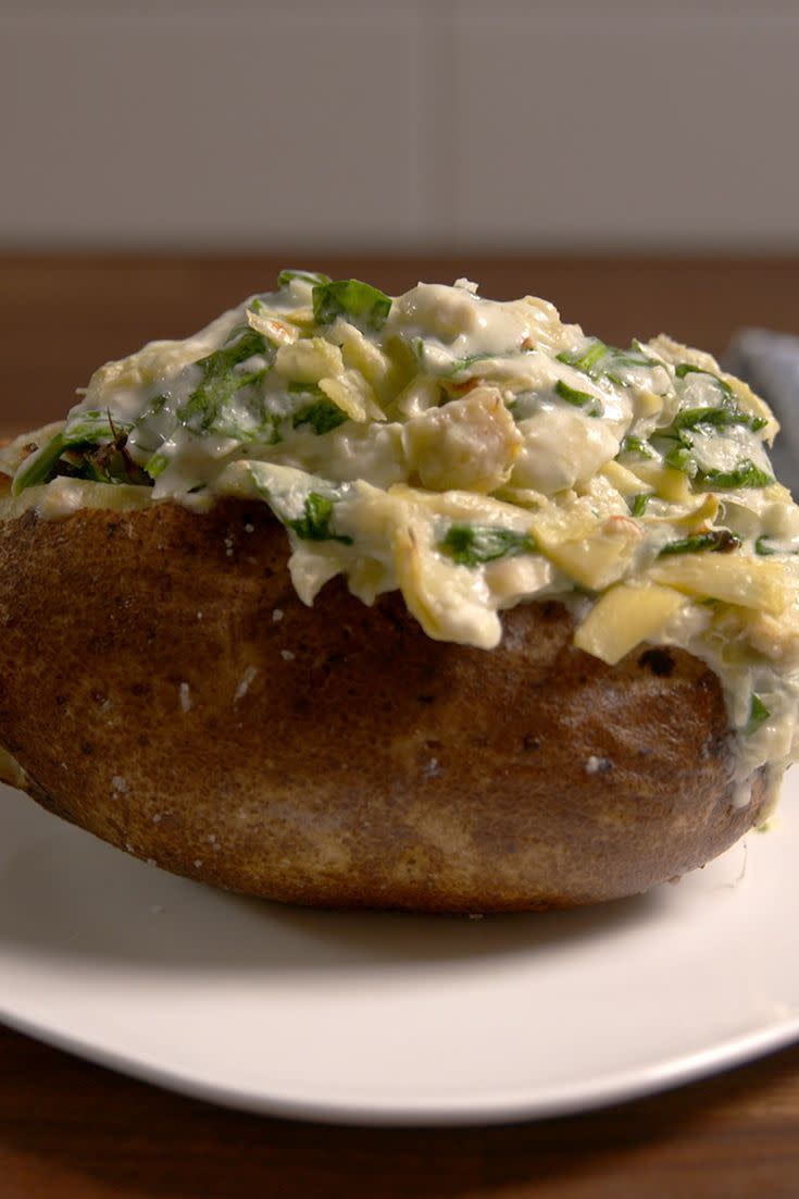 <p>Give the old baked potato a major upgrade.</p><p>Get the recipe from <a href="https://www.delish.com/cooking/recipe-ideas/recipes/a50810/spinach-artichoke-baked-potatoes/" rel="nofollow noopener" target="_blank" data-ylk="slk:Delish;elm:context_link;itc:0;sec:content-canvas" class="link ">Delish</a>.</p>