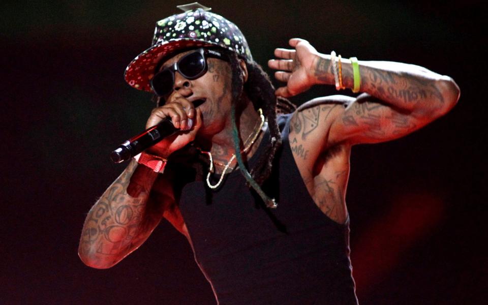 Lil Wayne performs during the 2015 iHeartRadio Music Festival at the MGM Grand Garden Arena in Las Vegas - Reuters