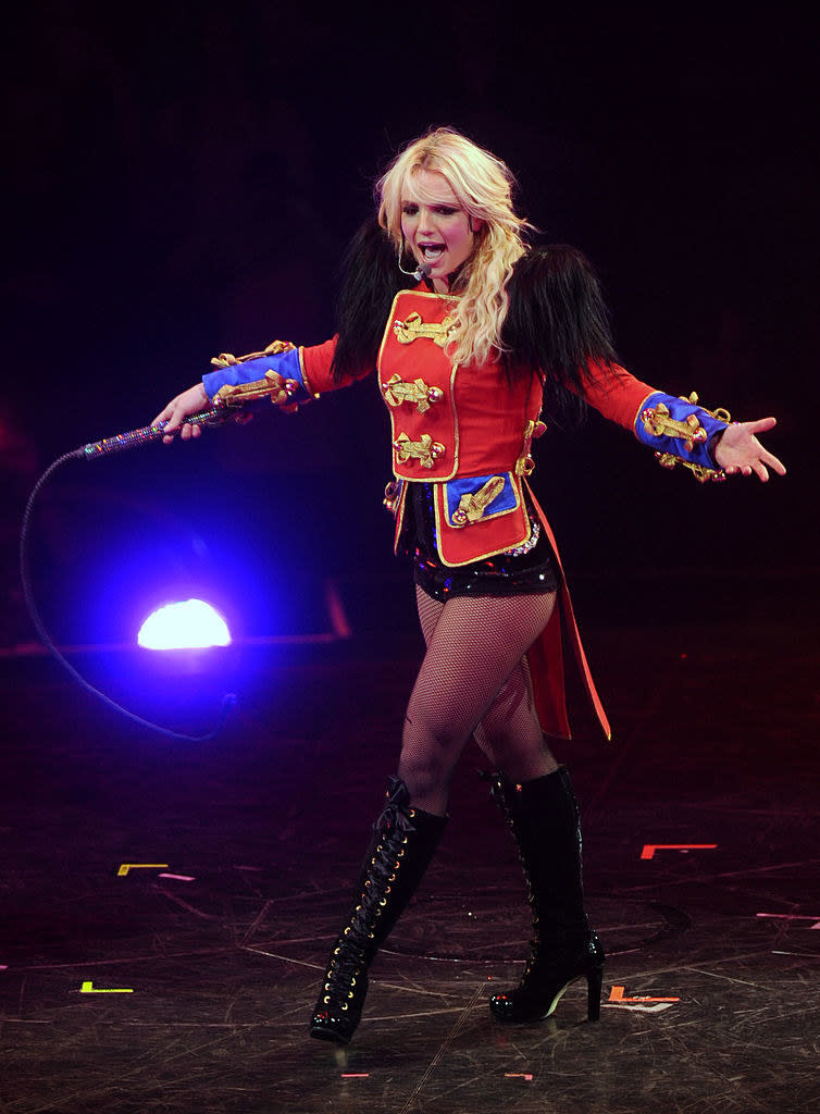 Britney performing in a ringmaster-inspired top and shorts with matching boots