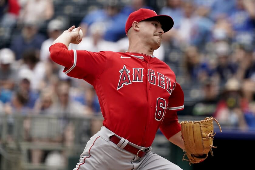 Los Angeles Angels starting catcher Janson Junk throws during the first inning of a baseball game against the Kansas City Royals Wednesday, July 27, 2022, in Kansas City, Mo. (AP Photo/Charlie Riedel)