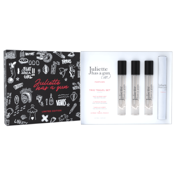 a black box with red writing and white caroon graphics with the label, Juliette Has A Gun sits next to an open box containing the brand's perfume Travel Trio in small transparent tubes with black lids.