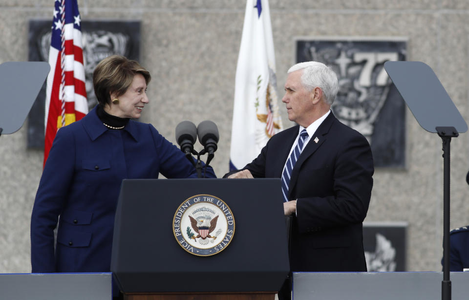 U.S. Secretary of the Air Force Barbara Barrett, left, bumps elbows to greet Vice President Mike Pence during the graduation ceremony for the class of 2020 at the U.S. Air Force Academy Saturday, April 18, 2020, at Air Force Academy, Colo. (AP Photo/David Zalubowski)