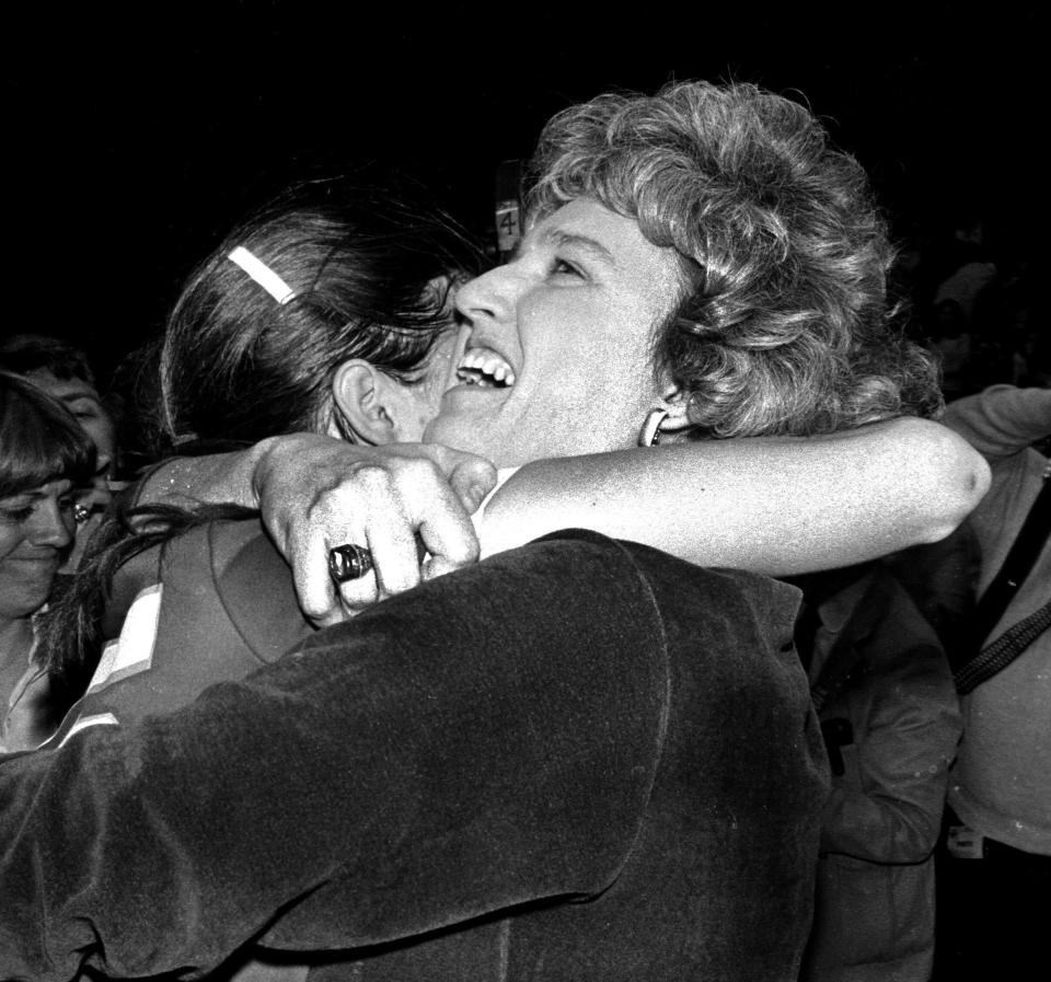 Rutgers women's basketball head coach Theresa Grentz embraces player June Olkowski after winning the AIAW Tournament in1982
(Photo: File photo)