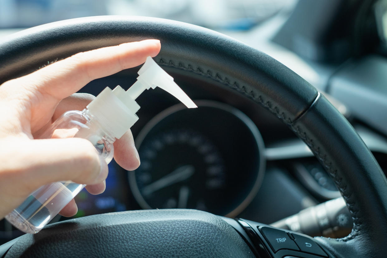 Now that the weather is warming up, many are wondering whether it's safe to keep hand sanitizer in your car. Experts say yes, but with some caveats. (Photo: Getty Images)