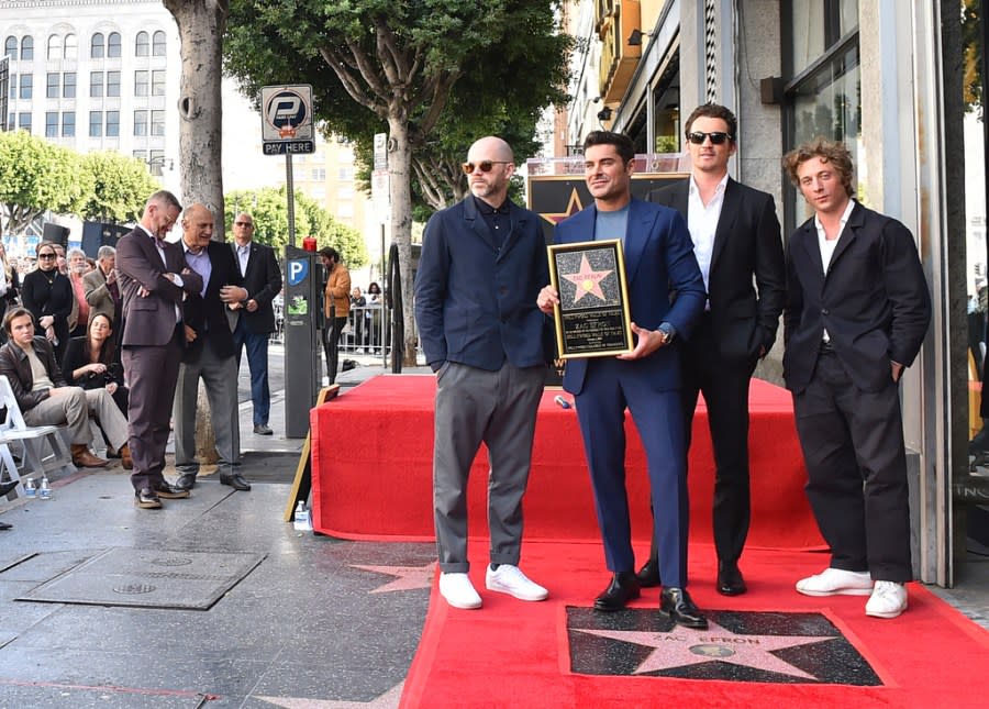 Sean Durkin, from left, Zac Efron, Miles Teller, and Jeremy Allen White attend a ceremony honoring Efron with a star on the Hollywood Walk of Fame on Monday, Dec. 11, 2023, in Los Angeles. (Photo by Jordan Strauss/Invision/AP)
