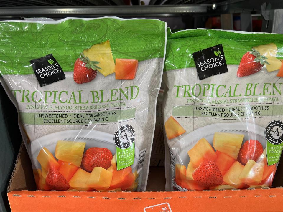 Season's Choice tropical blend of frozen fruit with green label and picture of pineapple, mango, papaya, and strawberry pieces on the front