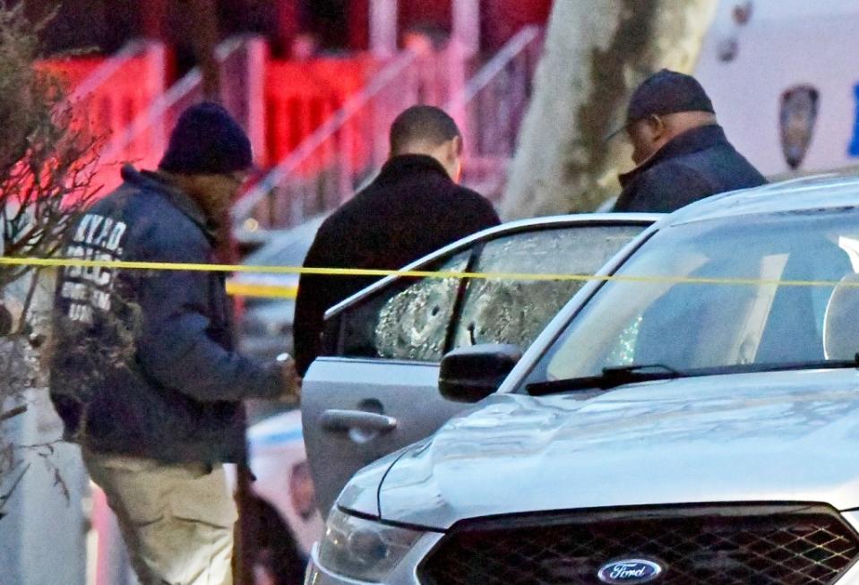 A bullet hole is seen in a window of car at the scene on Remsen Avenue and East 57th Street, Brooklyn. Wayne Carrington for NY Post