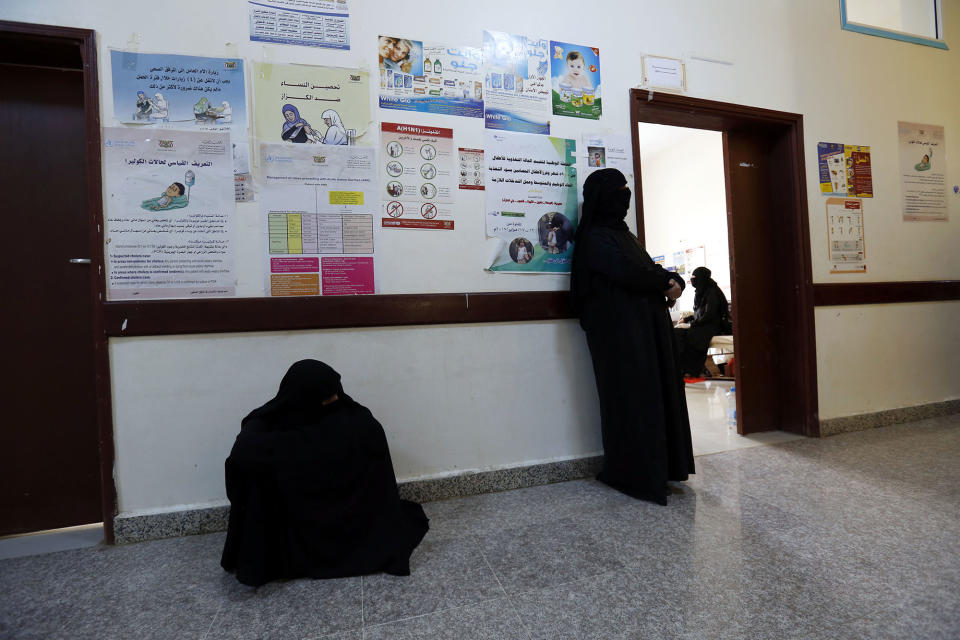 <p>Yemeni women wait for their cholera-infected relatives receiving treatment at a hospital amid a serious cholera outbreak in Sana’a, Yemen on June 22, 2017. (Yahya Arhab/EPA/REX/Shutterstock) </p>