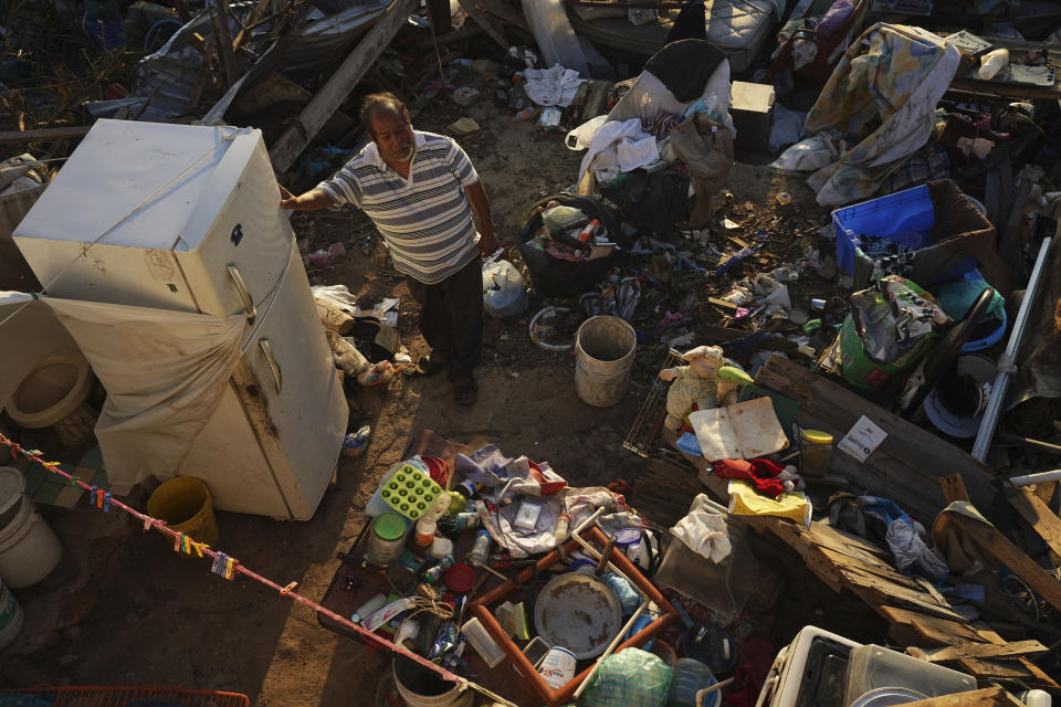 Jaime Sosa stands inside his home destroyed by Hurricane Otis, in Acapulco, Mexico, Thursday, Nov. 9, 2023. Nearly three weeks after the Category 5 hurricane devastated this Pacific port, leaving at least 48 people dead and the city’s infrastructure in tatters, the cleanup continues. (AP Photo/Marco Ugarte)
