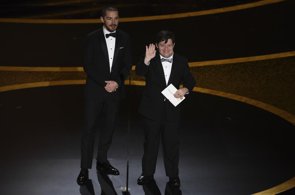 Shia LaBeouf, left, and Zack Gottsagen present the award for best live action short film at the Oscars on Sunday, Feb. 9, 2020, at the Dolby Theatre in Los Angeles. (AP Photo/Chris Pizzello)