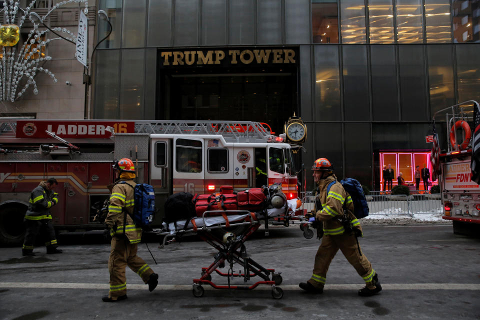 Fire crews rush to the scene in Manhattan after the blaze started on the skyscraper’s roof. (Reuters)