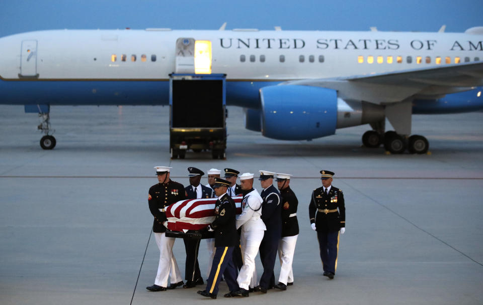 <p>The flag-draped casket of Sen. John McCain, R-Ariz., is carried by an Armed Forces body bearer team to a hearse, Thursday, Aug. 30, 2018, at Andrews Air Force Base, Md. (Photo: Alex Brandon/AP) </p>