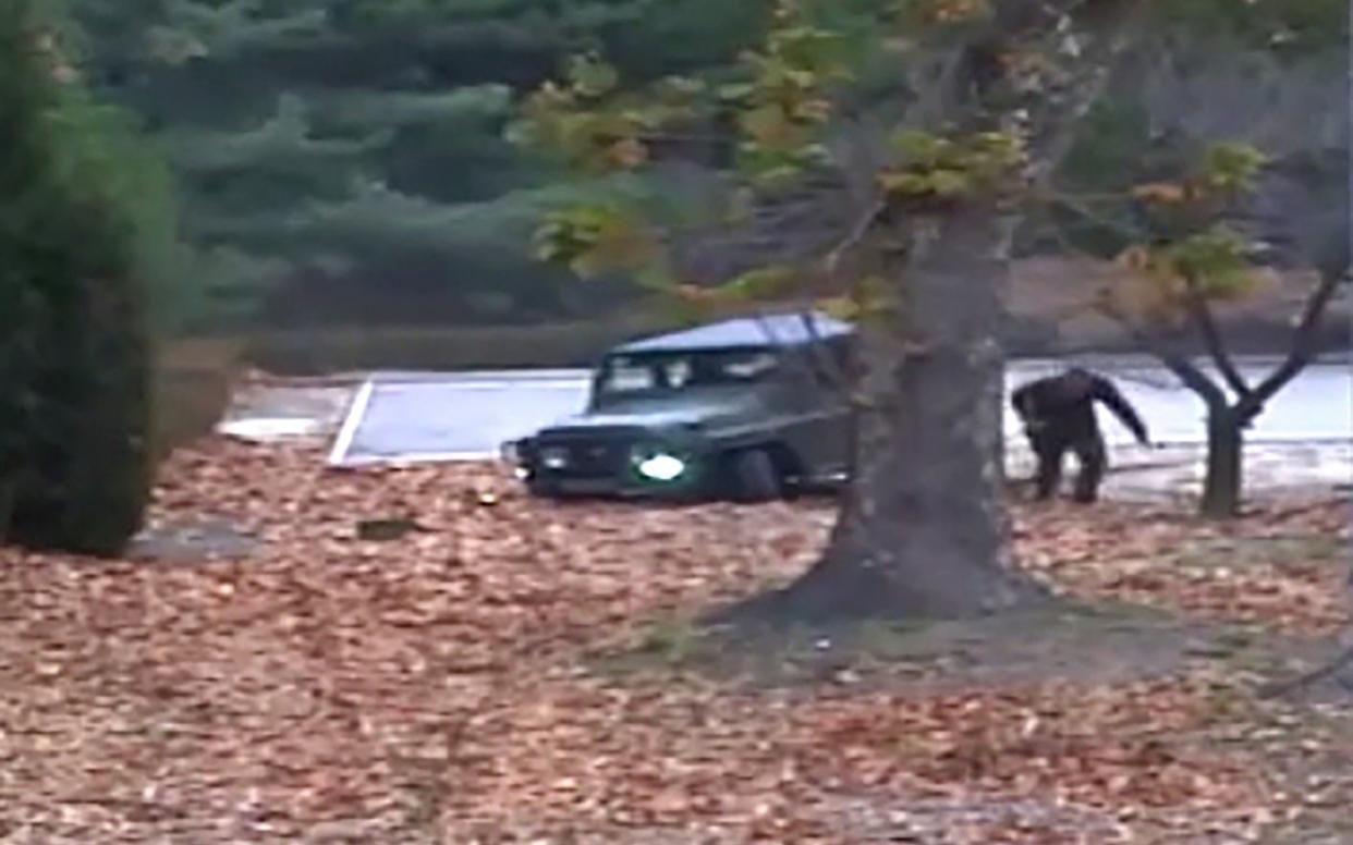 The North Korea soldier runs towards the border in his escape to the South - AFP