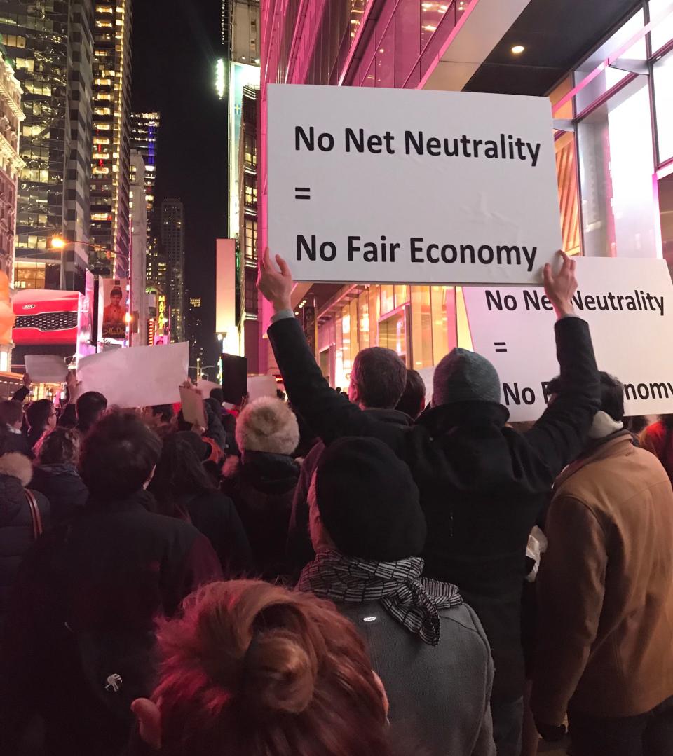 Net neutrality supporters gather at a rally in front of a Verizon store on 42nd Street in New York City on Dec. 7. (Photo: Jenna Amatulli)